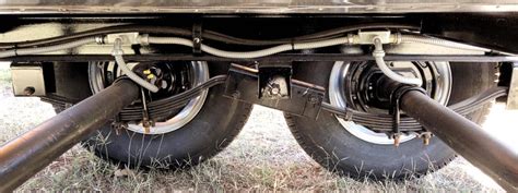 This item is a Trailer axle assembly with the following Axles Tandem, Suspension Air, Width 8&39;, Tires 44550R22. . Tandem axle trailer suspension problems